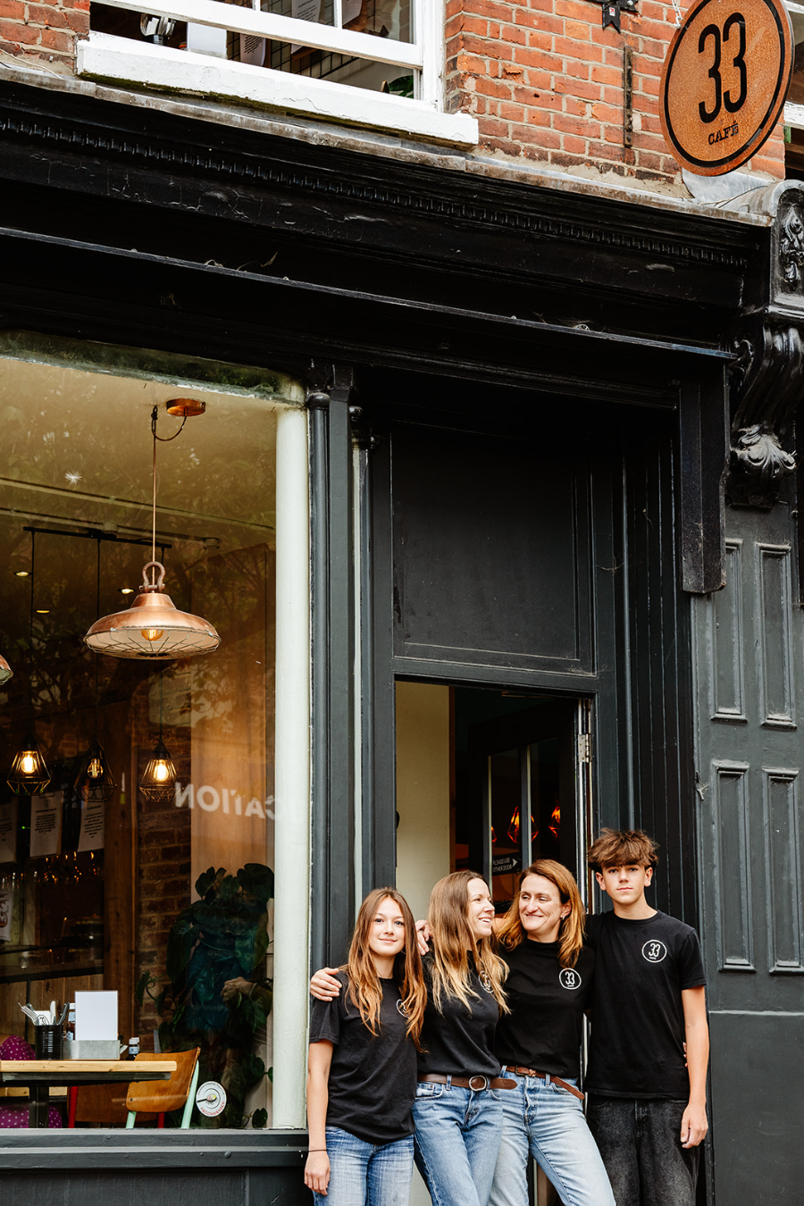 Nichola, Madelie and family outside No33, 33 Exchange Street, Norwich